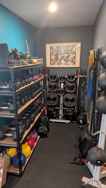 Shelves of dumbbells, kettlebells and plates